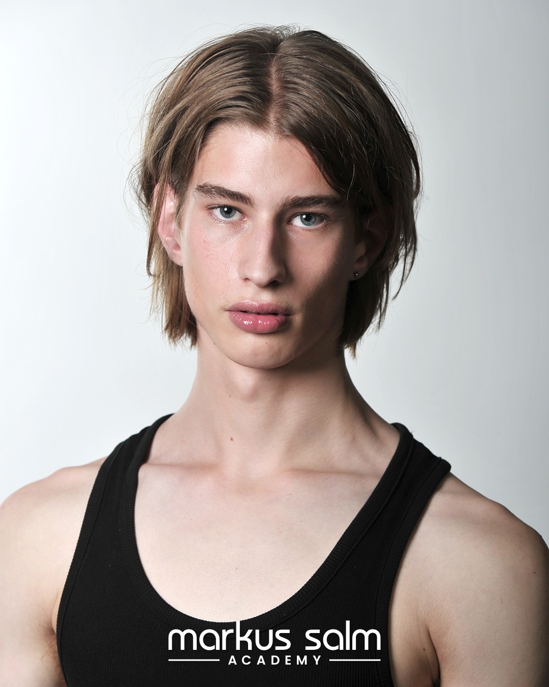 Mid-Length Center-Parted Straight Hairstyle for Guys